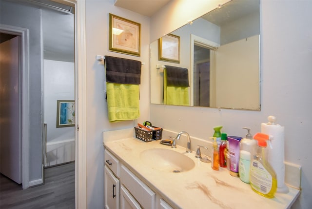 2924 Camelot Ln, Missouri City, TX 77459 - bathroom with wood finished floors and vanity