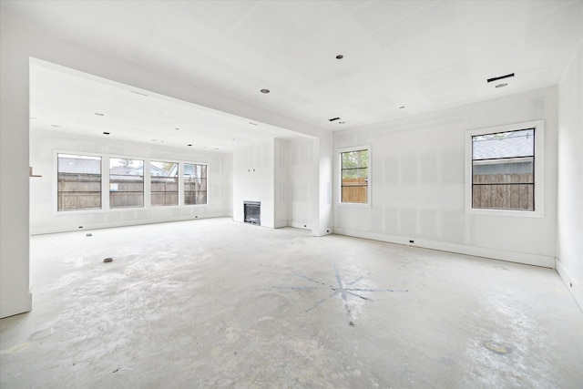 1710 Ebony Ln, Houston, TX 77018 - unfurnished living room featuring concrete floors