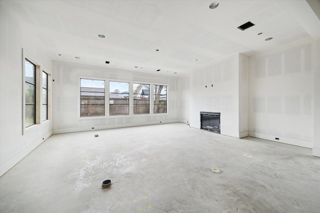 1710 Ebony Ln, Houston, TX 77018 - unfurnished living room featuring unfinished concrete floors and a fireplace