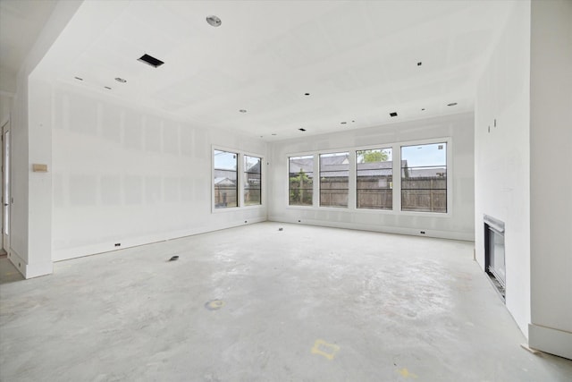 1710 Ebony Ln, Houston, TX 77018 - spare room with concrete flooring and a glass covered fireplace