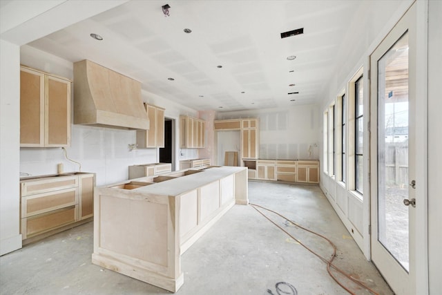 1710 Ebony Ln, Houston, TX 77018 - kitchen featuring light brown cabinetry, concrete flooring, a center island, and recessed lighting