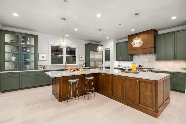1710 Ebony Ln, Houston, TX 77018 - kitchen with green cabinetry, built in fridge, backsplash, and recessed lighting