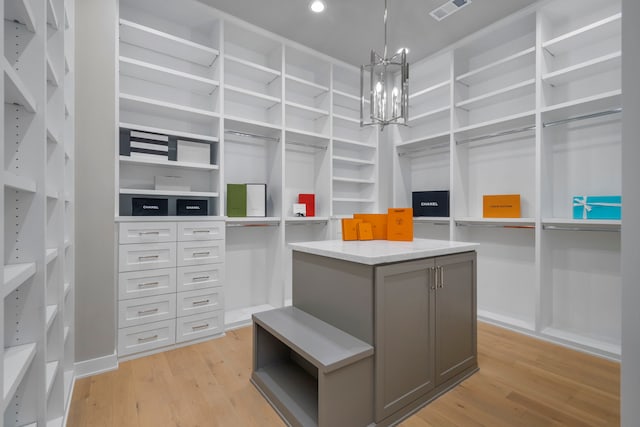 1710 Ebony Ln, Houston, TX 77018 - spacious closet with a chandelier and light wood-type flooring