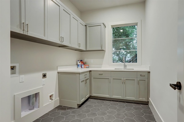 1710 Ebony Ln, Houston, TX 77018 - washroom featuring electric dryer hookup, cabinet space, tile patterned flooring, washer hookup, and baseboards