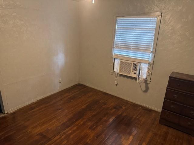 5111 Kelso St, Houston, TX 77021 - spare room featuring dark wood-style floors and cooling unit