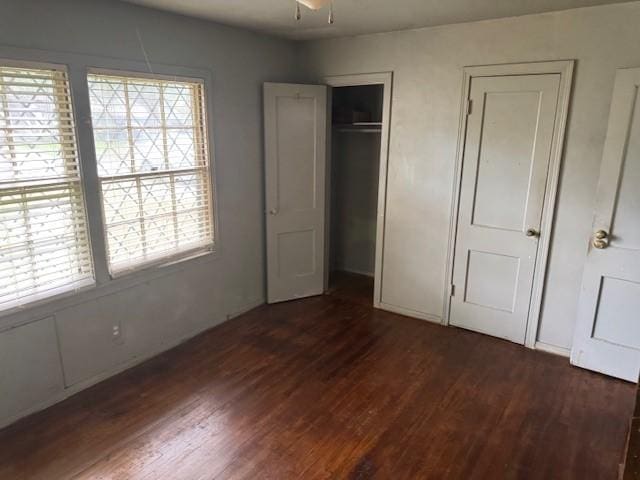 5111 Kelso St, Houston, TX 77021 - unfurnished bedroom with dark wood-type flooring and multiple windows