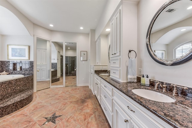 6 Woodsborough Cir, Houston, TX 77055 - bathroom featuring a shower stall, a garden tub, double vanity, and recessed lighting