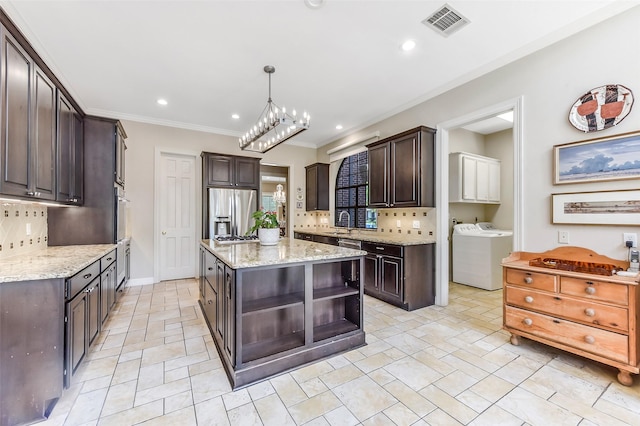 6 Woodsborough Cir, Houston, TX 77055 - kitchen with open shelves, stainless steel appliances, dark brown cabinets, tasteful backsplash, and crown molding