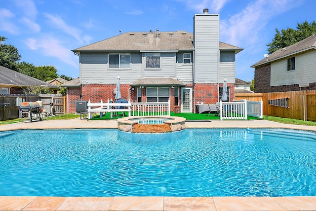 4026 Almond Lake Dr, Houston, TX 77047 - view of pool featuring a fenced backyard, a pool with connected hot tub, a patio, and area for grilling