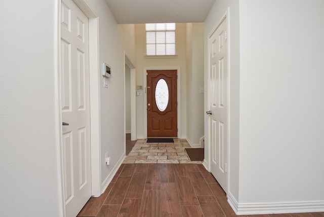 4026 Almond Lake Dr, Houston, TX 77047 - foyer with baseboards and dark wood-style floors