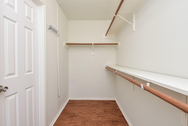 4026 Almond Lake Dr, Houston, TX 77047 - walk in closet with dark wood-type flooring