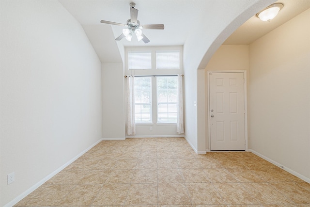 20210 Stonebridge Terrace Dr, Richmond, TX 77407 - entrance foyer featuring arched walkways, ceiling fan, and light tile patterned floors