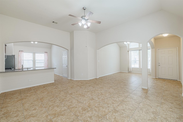 20210 Stonebridge Terrace Dr, Richmond, TX 77407 - unfurnished room featuring ceiling fan, arched walkways, and light tile patterned floors