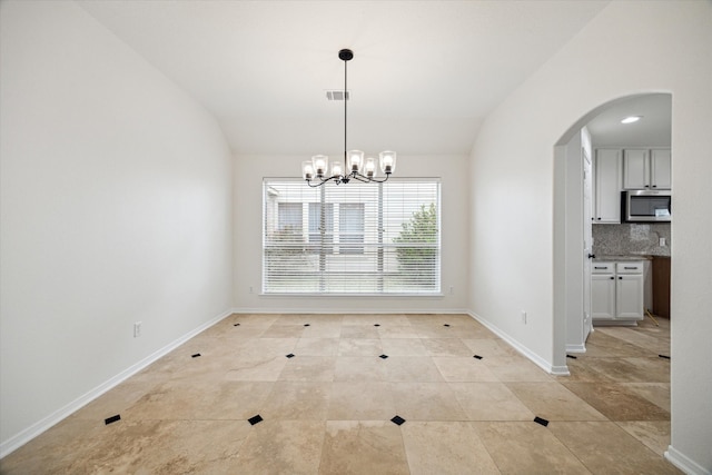 18519 Water Scene Trl, Cypress, TX 77429 - unfurnished dining area with arched walkways, vaulted ceiling, a chandelier, baseboards, and light tile patterned floors