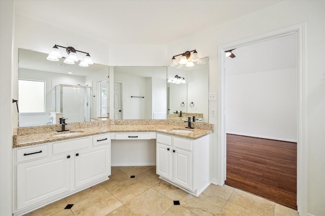 18519 Water Scene Trl, Cypress, TX 77429 - full bath with double vanity, a stall shower, tile patterned flooring, and a chandelier