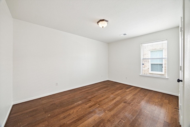 18519 Water Scene Trl, Cypress, TX 77429 - empty room featuring dark wood-type flooring and baseboards