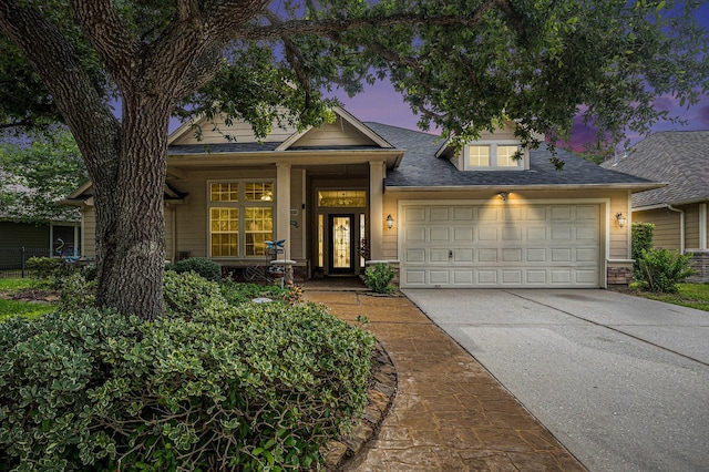 1630 Pebble Banks Ln, Seabrook, TX 77586 - view of front of home featuring a garage, driveway, a shingled roof, and a porch