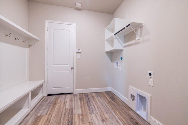 2002 Morton Cove Ct, Richmond, TX 77469 - laundry room with electric dryer hookup, light wood-style floors, hookup for a washing machine, and baseboards