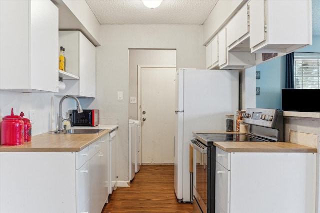 5707 Cripple Brook Ct, Houston, TX 77017 - kitchen featuring electric range, washer and dryer, a sink, wood finished floors, and white cabinetry
