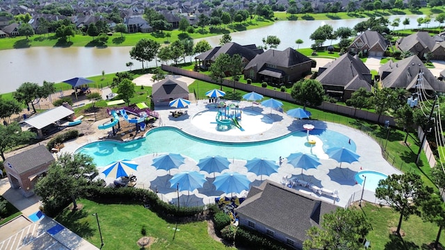 2304 Shadow Canyon Ct, Pearland, TX 77584 - aerial perspective of suburban area featuring a pool and a nearby body of water