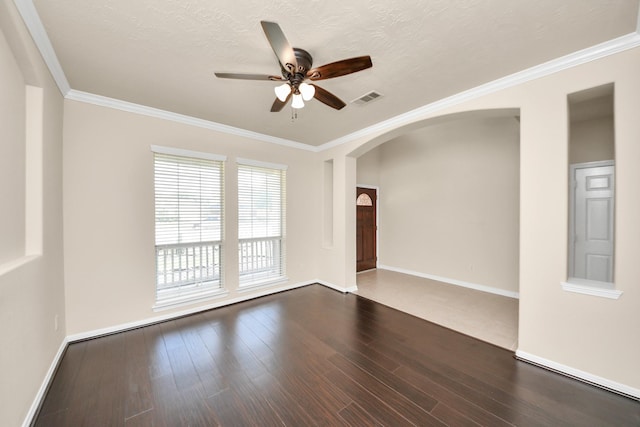 2304 Shadow Canyon Ct, Pearland, TX 77584 - spare room with arched walkways, ceiling fan, wood finished floors, crown molding, and baseboards