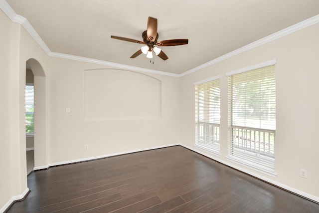 2304 Shadow Canyon Ct, Pearland, TX 77584 - spare room with ceiling fan, dark wood-type flooring, arched walkways, ornamental molding, and baseboards