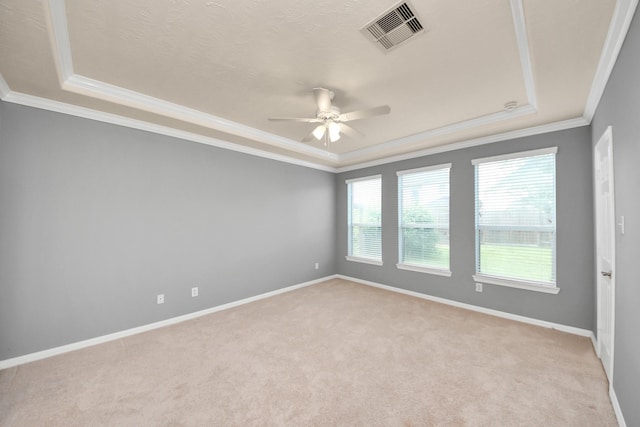 2304 Shadow Canyon Ct, Pearland, TX 77584 - empty room with a ceiling fan, crown molding, light colored carpet, a raised ceiling, and baseboards