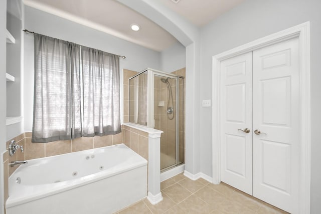 2304 Shadow Canyon Ct, Pearland, TX 77584 - full bathroom featuring a tub with jets, a stall shower, and tile patterned flooring