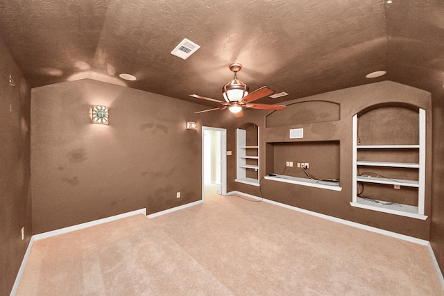 2304 Shadow Canyon Ct, Pearland, TX 77584 - unfurnished living room featuring lofted ceiling, built in features, carpet, baseboards, and ceiling fan