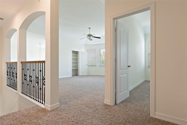 19406 Egret Haven Ln, Cypress, TX 77433 - hallway featuring carpet flooring, baseboards, and built in shelves