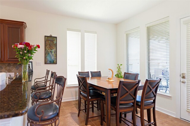 19406 Egret Haven Ln, Cypress, TX 77433 - dining area featuring light tile patterned flooring and baseboards