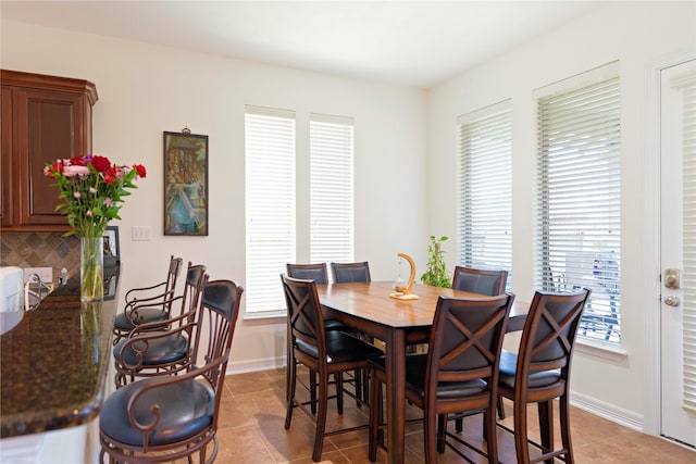 19406 Egret Haven Ln, Cypress, TX 77433 - dining area with light tile patterned flooring and baseboards