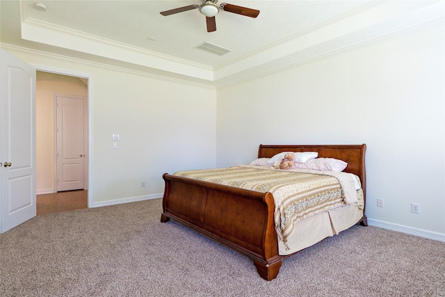 19406 Egret Haven Ln, Cypress, TX 77433 - carpeted bedroom with a raised ceiling, ornamental molding, baseboards, and a ceiling fan