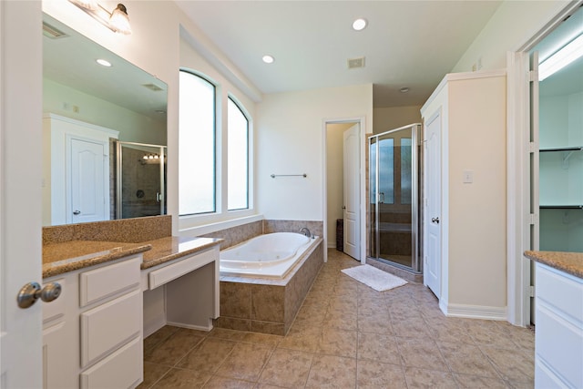 19406 Egret Haven Ln, Cypress, TX 77433 - bathroom with vanity, a shower stall, a tub with jets, a closet, and recessed lighting