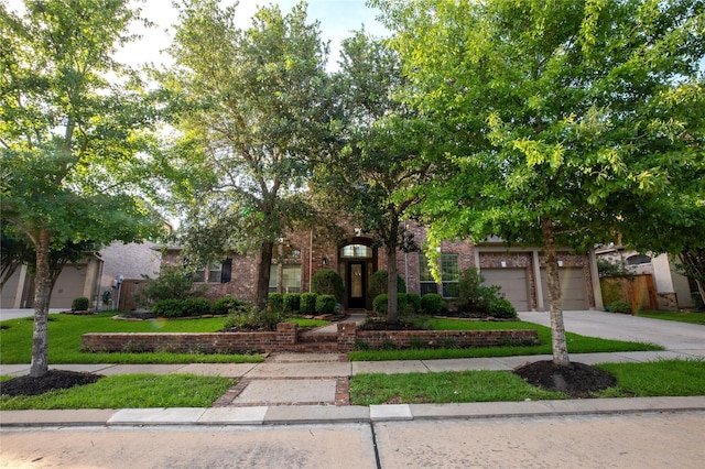 19406 Egret Haven Ln, Cypress, TX 77433 - obstructed view of property with driveway and brick siding