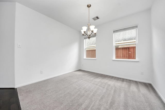 3727 Varna Ct, Missouri City, TX 77459 - empty room with healthy amount of natural light, a chandelier, baseboards, and carpet flooring