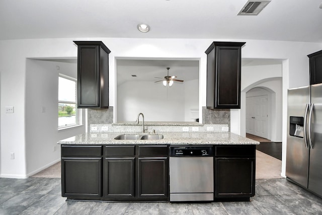 3727 Varna Ct, Missouri City, TX 77459 - kitchen featuring stainless steel appliances, a sink, tasteful backsplash, and ceiling fan