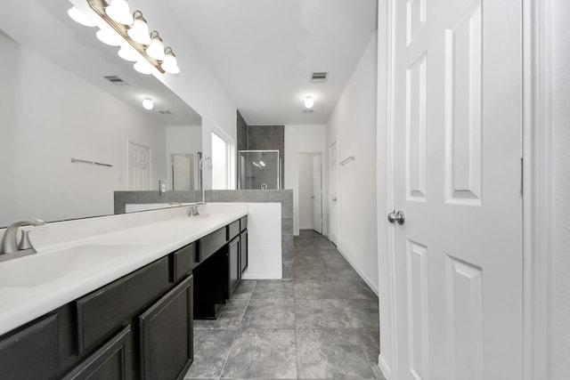 3727 Varna Ct, Missouri City, TX 77459 - bathroom featuring double vanity, walk in shower, and baseboards