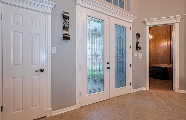 1806 Wine Cedar Ln, Katy, TX 77450 - foyer entrance with french doors, light tile patterned floors, and baseboards