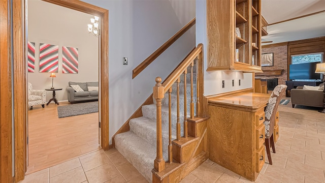 1806 Wine Cedar Ln, Katy, TX 77450 - staircase featuring baseboards and a fireplace