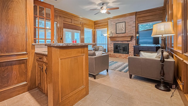 1806 Wine Cedar Ln, Katy, TX 77450 - living room with a ceiling fan, light tile patterned floors, a fireplace, and wooden walls