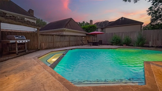 1806 Wine Cedar Ln, Katy, TX 77450 - pool at dusk with a patio, a fenced backyard, a pool with connected hot tub, and a grill