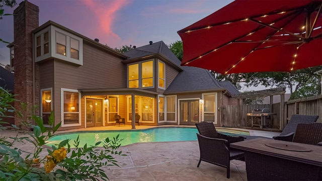 1806 Wine Cedar Ln, Katy, TX 77450 - back of property with a patio area and french doors