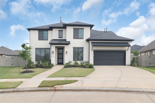 4706 Oak Glen Ct, Manvel, TX 77578 - view of front of house with stucco siding, a standing seam roof, an attached garage, and concrete driveway
