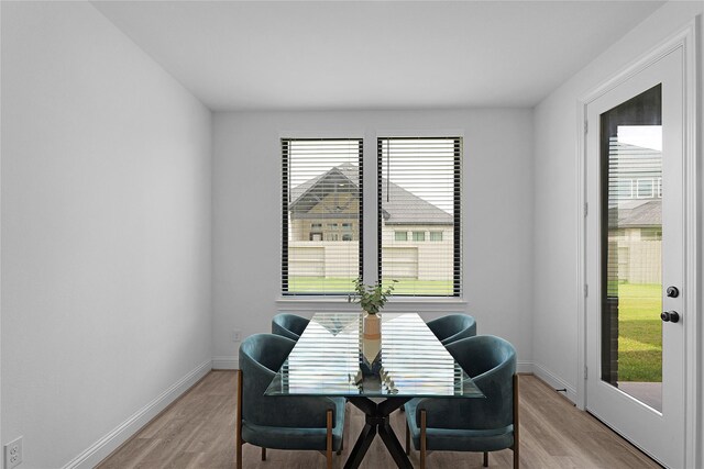 4706 Oak Glen Ct, Manvel, TX 77578 - dining room featuring light wood finished floors and baseboards