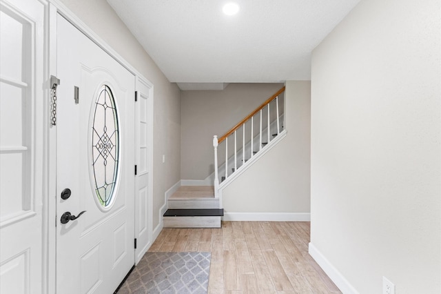 4519 Pioneer Trl, Sugar Land, TX 77479 - entryway featuring light wood-type flooring, baseboards, stairway, and recessed lighting
