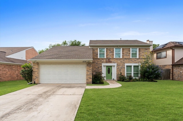4519 Pioneer Trl, Sugar Land, TX 77479 - view of front of home with concrete driveway, a front lawn, an attached garage, brick siding, and a shingled roof