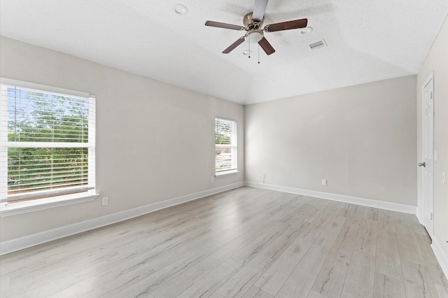 4519 Pioneer Trl, Sugar Land, TX 77479 - spare room featuring a ceiling fan, light wood-style flooring, lofted ceiling, and baseboards