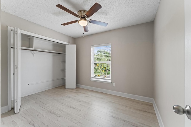 4519 Pioneer Trl, Sugar Land, TX 77479 - unfurnished bedroom with wood finished floors, a closet, baseboards, and a textured ceiling
