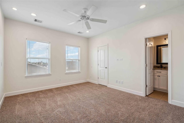 5402 Jonathan Ln, Houston, TX 77011 - unfurnished bedroom featuring light colored carpet, baseboards, recessed lighting, ensuite bath, and ceiling fan